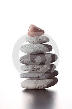 Stack of zen stones concept piled up on white background