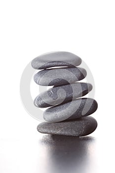 Stack of zen stones concept piled up on white background