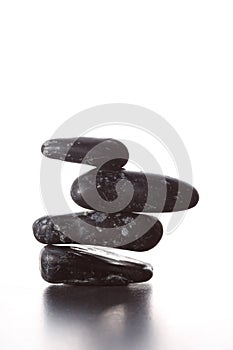 Stack of zen stones concept piled up on white background