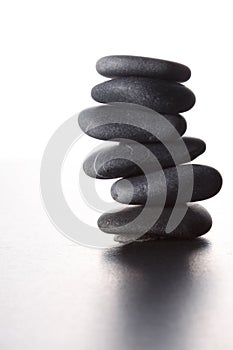 Stack of zen stones concept piled up on white background
