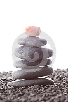 Stack of zen stones concept piled up on white background