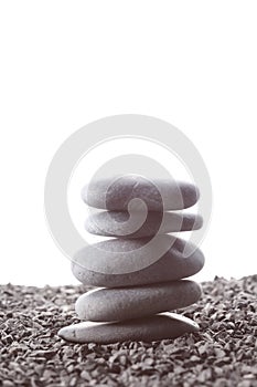 Stack of zen stones concept piled up on white background