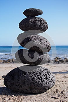 Stack of zen stones near beach