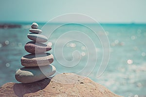 Stack of zen stones near sea. Harmony, balance