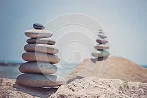 Stack of zen stones near sea. Harmony, balance