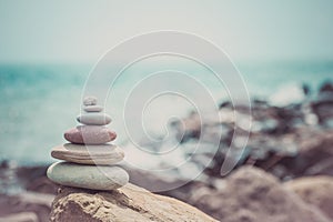 Stack of zen stones near sea. Harmony, balance