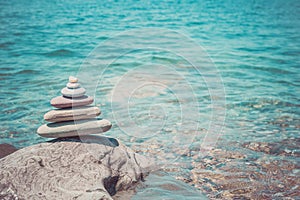 Stack of zen stones near sea. Harmony, balance