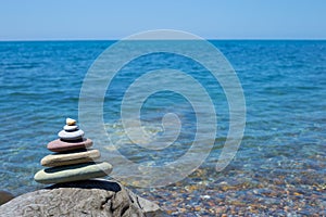 Stack of zen stones near sea. Harmony, balance