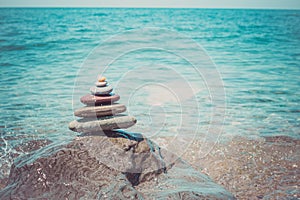 Stack of zen stones near sea. Harmony, balance