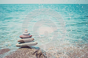 Stack of zen stones near sea. Harmony, balance