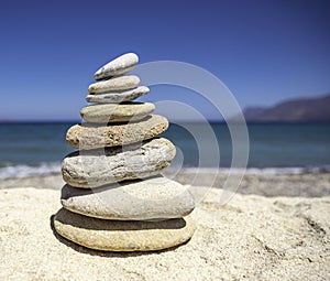 Stack of zen stones on pebble beach