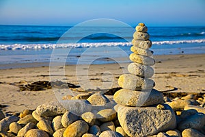 Stack of zen stones on pebble beach. Beach landscape.