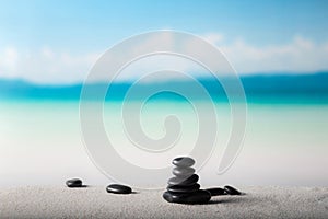 Stack of zen stones on sand beach