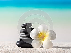 Stack of zen stones on sand beach