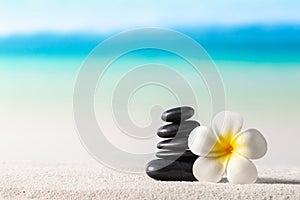 Stack of zen stones on sand beach