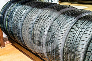 Stacked Black Car Tires In A Shop