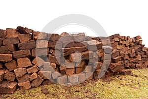 Stacked bog peat turf briquette cuttings drying