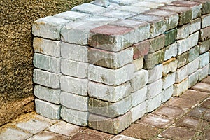 Stacked bricks near the wall