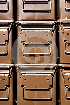 Stacked brown ammunition boxes
