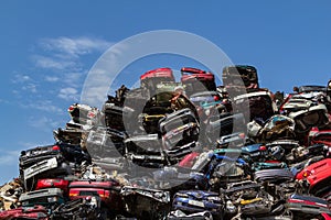 Stacked cars at a junkyard. photo