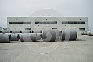 Stacked cement pipes at concrete factory