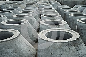 Stacked cement pipes at concrete factory