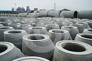 Stacked cement pipes at concrete factory