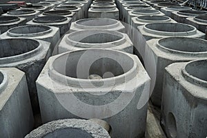 Stacked cement pipes at concrete factory