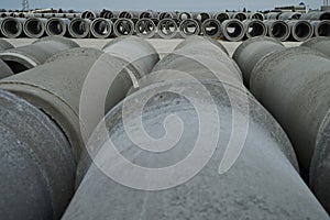 Stacked cement pipes at concrete factory