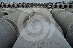 Stacked cement pipes at concrete factory