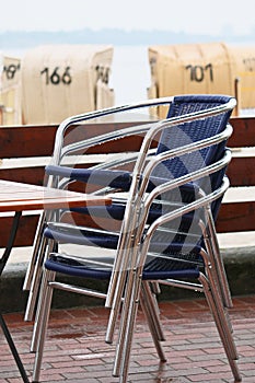 Stacked chairs on the beach