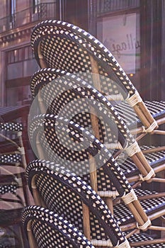 Stacked chairs in a street restaurant