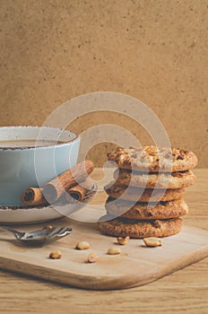 Stacked chip cookies with nuts and coffee cup/ stacked chip coo