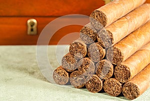 Stacked cigars and humidor