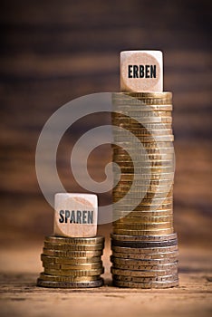 Stacked coins showing unjust difference between saving money and inheriting it photo