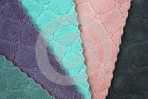 stacked colorful microfiber cleaning cloths background.