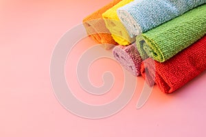 Stacked colorful microfiber cleaning cloths on a white background.House cleaning products.Textile for cleaning and