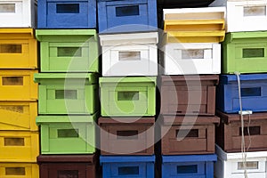 Stacked of colorful new bee houses