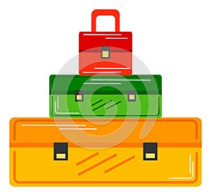 Stacked colorful suitcases, vacation luggage ready for travel. Colorful travel bags arranged for holiday journey