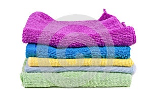 Stacked colorful towels on white background