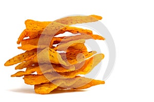 Stacked corn chips in a row on white background