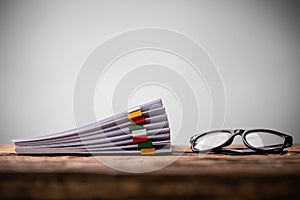 Stacked Documents With Colorful Paperclips