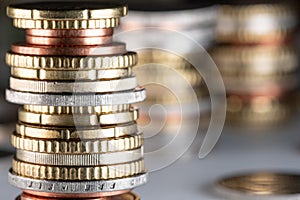 Stacked Euro coins, in different sizes