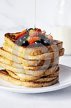 Stacked french toast with mixed berries, breakfast food photography