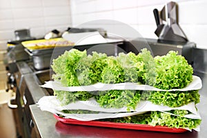 Stacked fresh frilly lettuce leaves photo