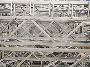Stacked galvanized steel structures. Metal products in the industrial outdoors storage site.