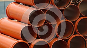 Stacked hdpe sewage pipes on construction site