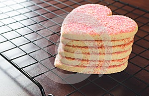 Stacked heart shaped valentines day cookies on cooling rack