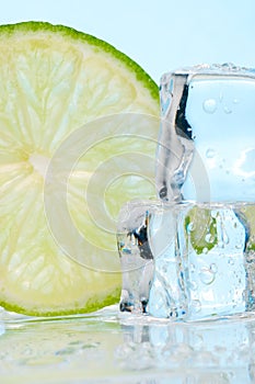 Stacked ice cubes and lime