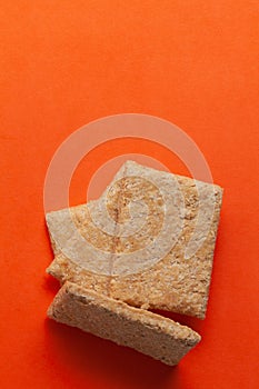 Stacked Indian mithai (dessert), delicate, soft, crunchy Gajak Bars.